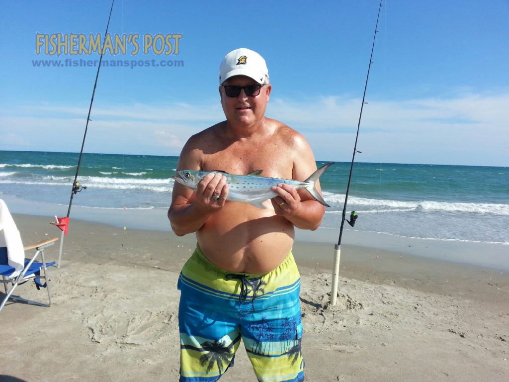 Shawn Furr, of Clayton, NC, with an 18" spanish mackerel that struck a piece of shrimp on a bluefish rig while he was surf fishing at Indian Beach.