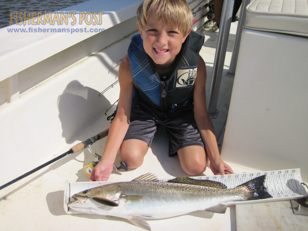 Hunter Sorrell (age 8) with his first citation speckled trout, a 26" fish that bit a Rapala Skitterwalk topwater plug while he was fishing the lower Neuse River with his father.