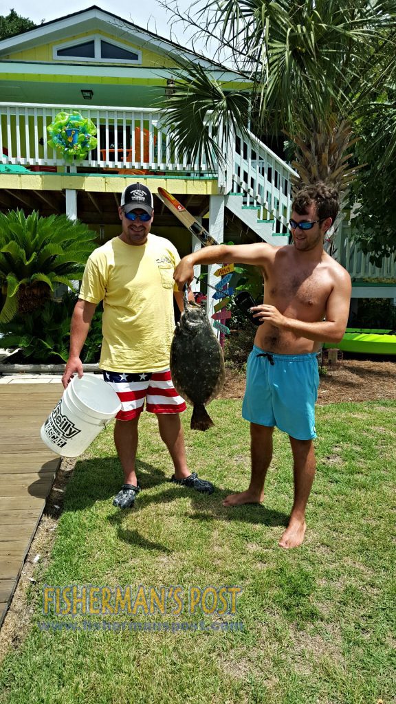 John Neese and Trent Duhan with a 5 lb., 6 oz. flounder that struck a trolled mud minnow in the ICW at Ocean Isle.