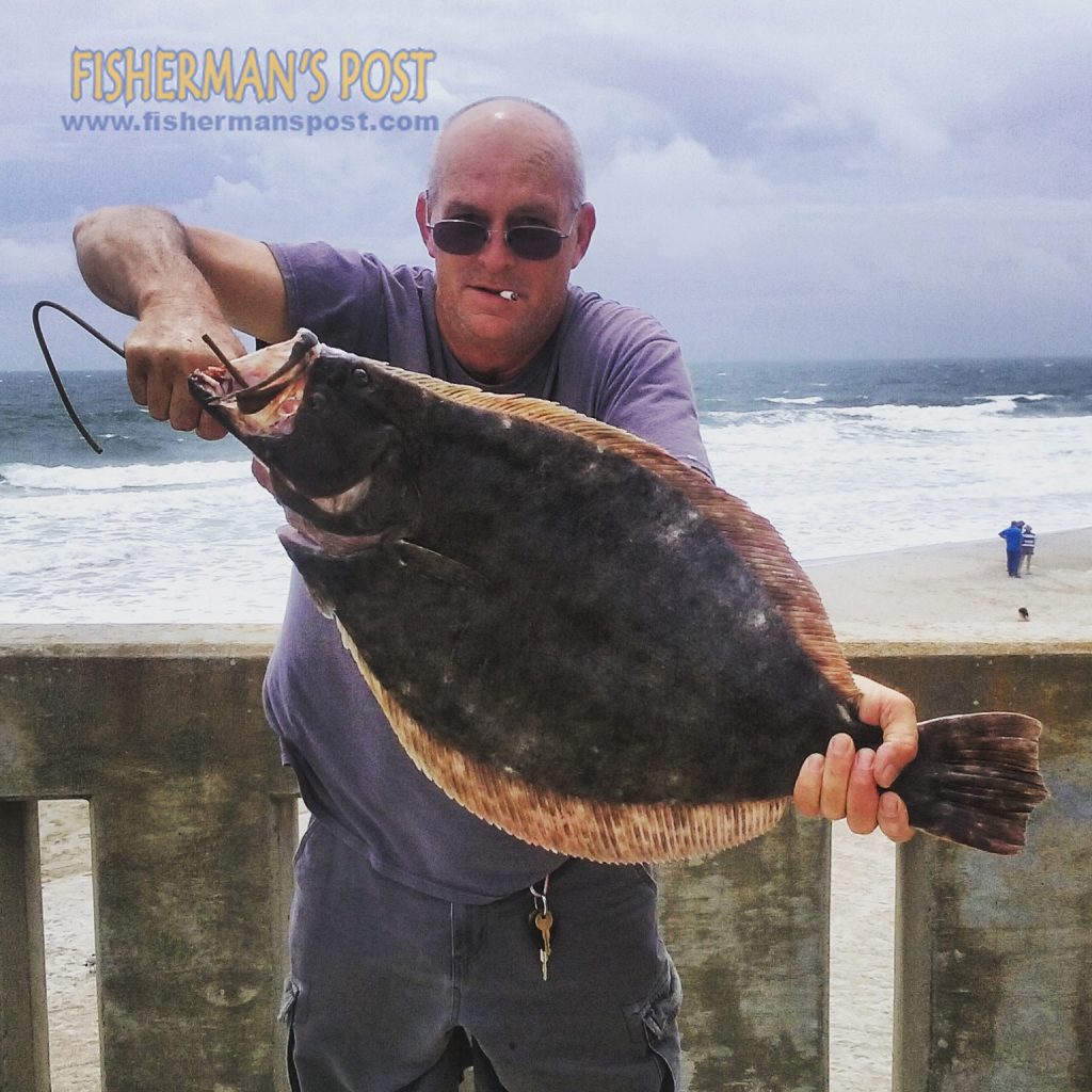 Donny Wood, of Wilmington, with a 9.0 lb. flounder that shattered the Johnnie Mercer's Pier record. The doormat bit a live finger mullet.