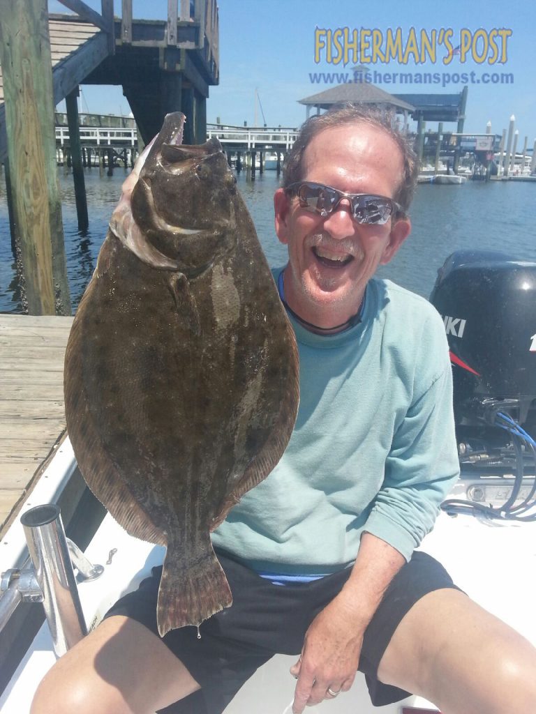 Phil Bales with a flounder he hooked at some nearshore structure off Masonboro Island while fishing with Capt. Jamie Rushing of Seagate Charters. The flatfish fell for a live finger mullet.