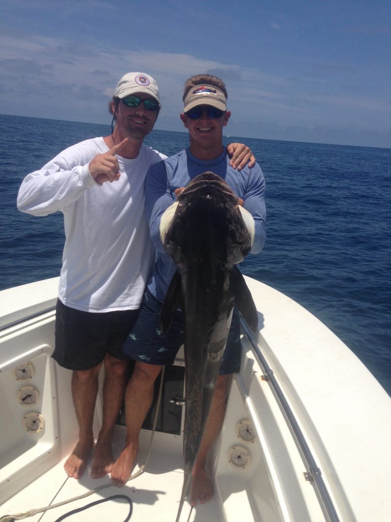 Matt Hinson and Dustin Wiles with a 46 lb. cobia they hooked on a green-skirted menhaden while trolling near the Raritan.