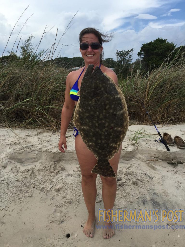 Amy Helms with a 7 lb. flounder that bit a live mullet in the Cape Fear River near Southport.