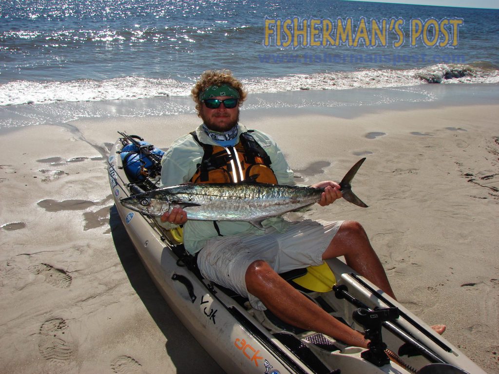 Andrw Imes, of Oak Island with a king mackerel that struck a live menhaden as he was kayak-trolling around Yaupon Reef.