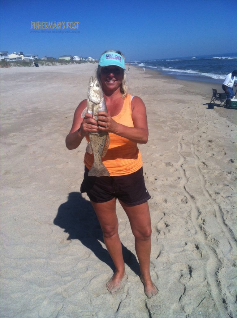 Terri L. Chabot with a 20" speckled trout that struck a piece of mullet in the Kure Beach surf.