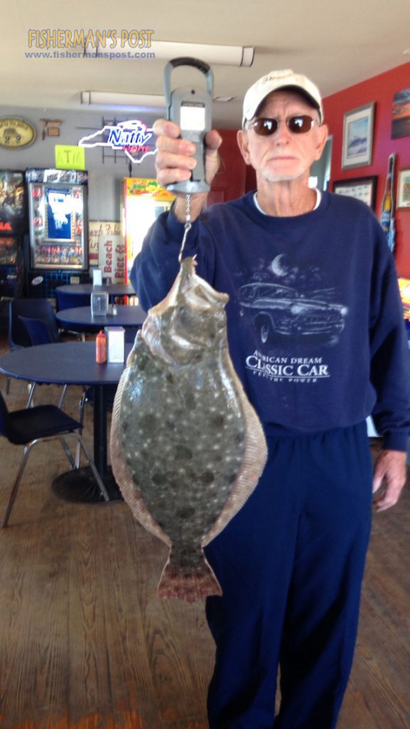 Walt Martin, of Winston-Salem, NC, with a 6.01 lb. flounder the landed off Carolina Beach Pier after it attacked a live shrimp.