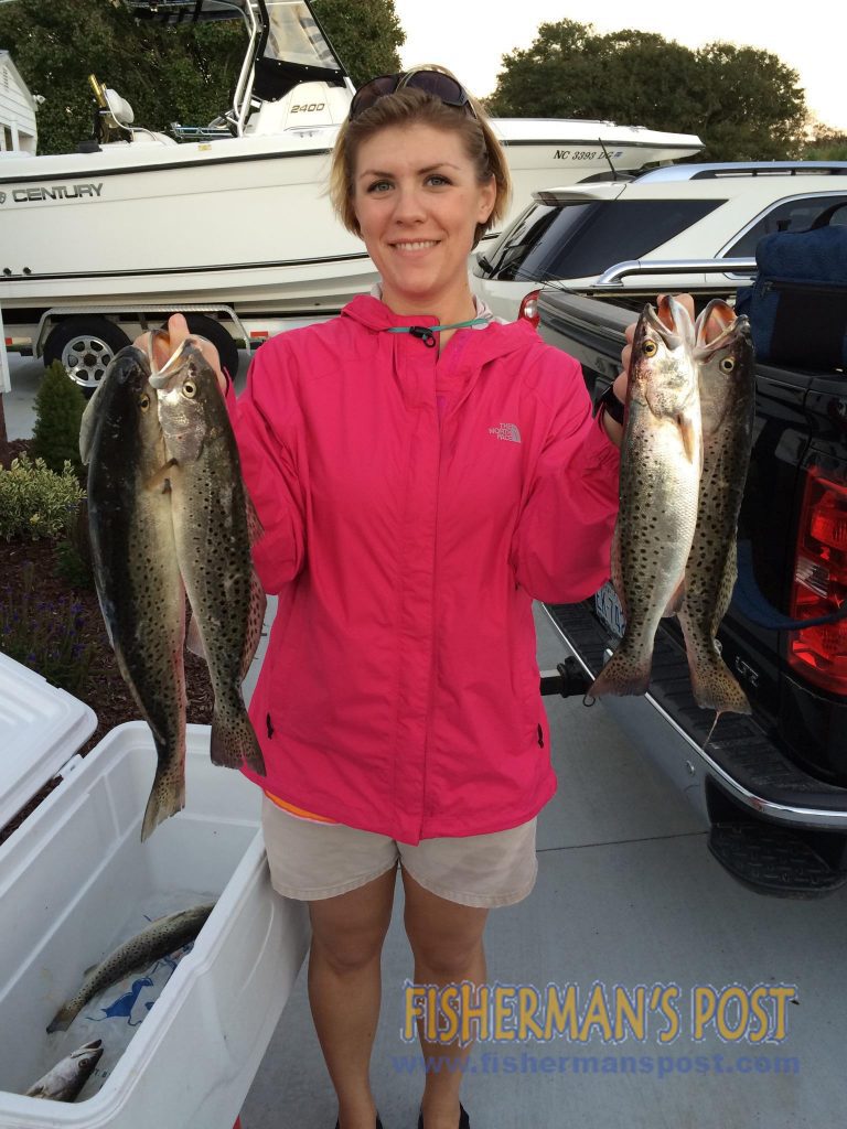 Bryanna Parker, of Cape Carteret, with a limit of speckled trout that bit Gulp shrimp in a channel near Emerald Isle.