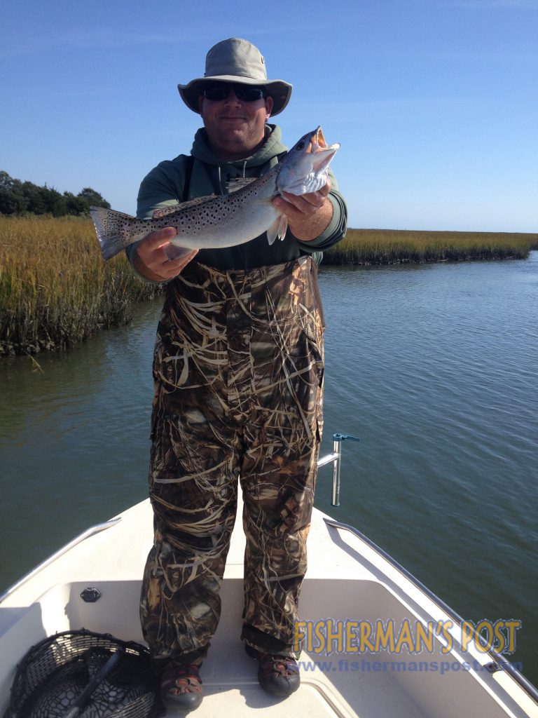 Mike Chenault with a 19" speckled trout that he hooked in a creek behind Lea Island.